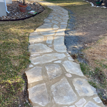 Southern Guys - a stone path in a backyard - Landscaping Near Me Southern Guys - a stone path in a backyard - Landscaping Near Me