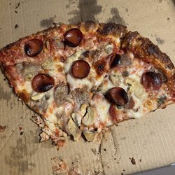 Rock & Roll Pizzeria SA - Medium 14" BYO. Note, the small amount of pepperoni randomly scattered, two slices of pepperoni per slice of pizza.