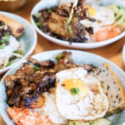 Pho Prime - Tender soy sauce chicken served with pork sausage, egg meatloaf, a fried egg, and a side of savory chicken broth.