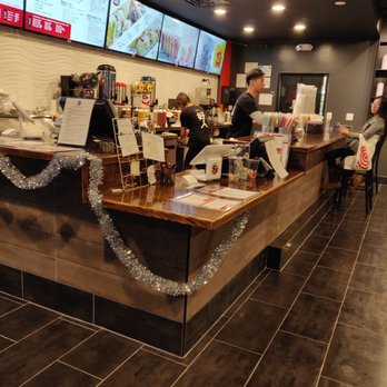 Tea-Do - Picture of the counter with the primary register (secondary register to the left) and cute drawings just beside the register - Bubble Tea Near Me - Annandale, Virginia