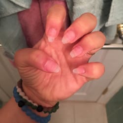 D & T Nail Salon - Such a horrible job. All of my nails are a different shape after she forcefully ripped my old tips off.