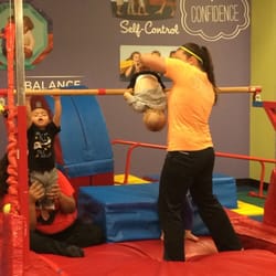 The Little Gym of Fayetteville - An example of a teacher working with a student