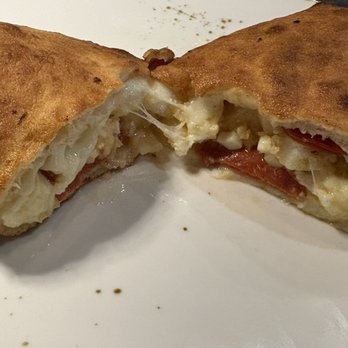 Mamma Mia - Calzone with pepperoni and chopped garlic - Italian Near Me - Riverside, California Mamma Mia - Calzone with pepperoni and chopped garlic - Italian Near Me - Riverside, California