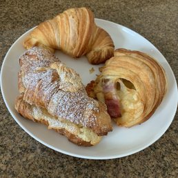 Plain, ham and cheese, and almond croissant Plain, ham and cheese, and almond croissant