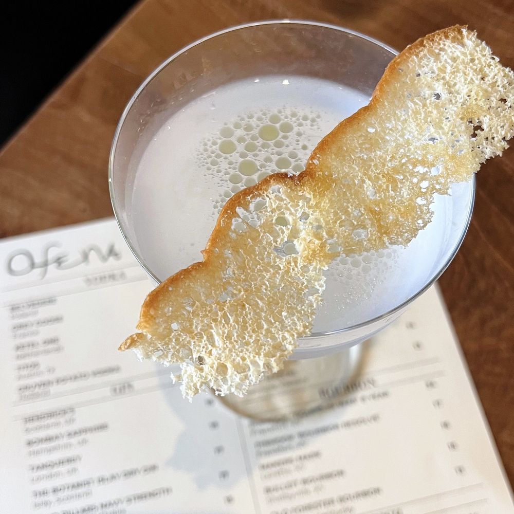 Ofena - Stemware at Dolores: Four Pillars Olive Leaf Gin w/ olive brine, vinegar oil, salt & vinegar focaccia chip | $16 (requested no olive brine) - Italian Near Me - San Francisco, California