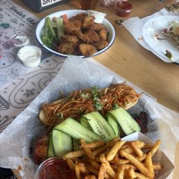 Bahn Mi Sandwich and fried pickles. Bahn Mi Sandwich and fried pickles.