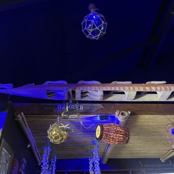 Tiki Republik - Canoe over bar - Tiki Bars Near Me - Lake Arrowhead, California Tiki Republik - Canoe over bar - Tiki Bars Near Me - Lake Arrowhead, California