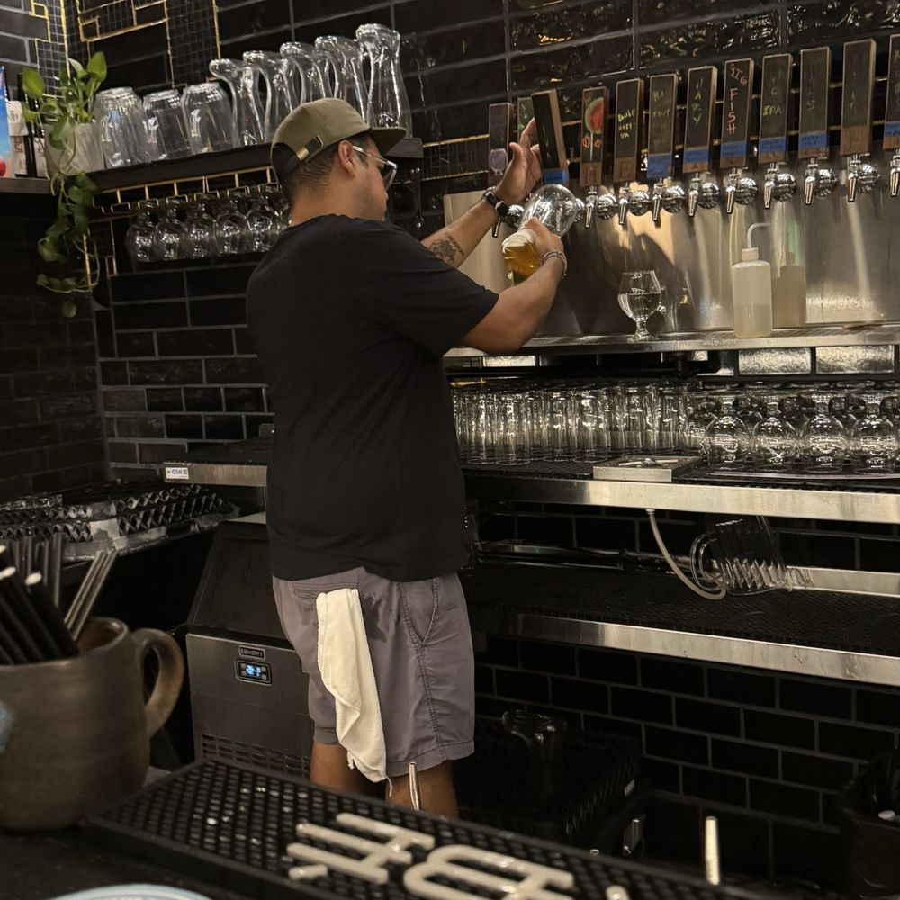 Bartender preparing the boot of beer.