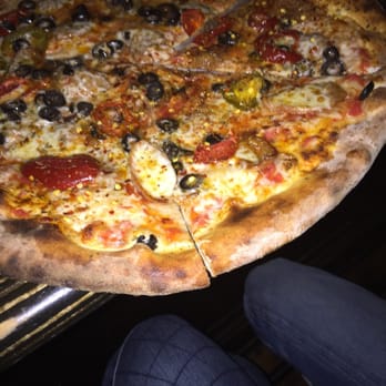 Brix & Rye - pie with mozzarella cherry peppers, black olives red, and fennel sausage - Cocktail Bars Near Me - Greenport, New York