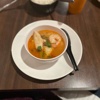 Siam Rice II - a bowl of soup and a spoon on a table - Thai Near Me - Saugus, California