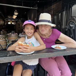 Happy daughter happy grandma with the almond and chocolate croissants. Happy daughter happy grandma with the almond and chocolate croissants.