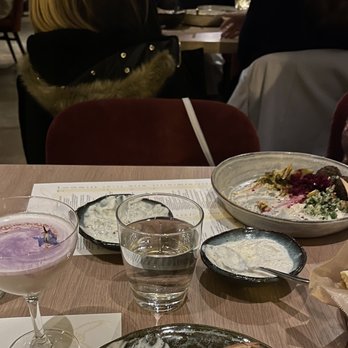 Rumi's Kitchen - Colony Square - L-R: Shazdeh Garden, Yogurt Duo, Falafel, Tehran Mule, and complimentary pita - Persian/Iranian Near Me - Atlanta, Georgia Rumi's Kitchen - Colony Square - L-R: Shazdeh Garden, Yogurt Duo, Falafel, Tehran Mule, and complimentary pita - Persian/Iranian Near Me - Atlanta, Georgia
