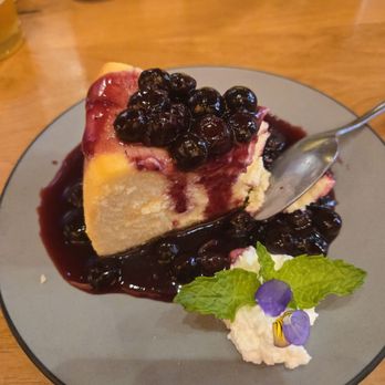 Rocking V Cafe - Cheesecake with a blueberry compote. - New American Near Me - Kanab, Utah Rocking V Cafe - Cheesecake with a blueberry compote. - New American Near Me - Kanab, Utah
