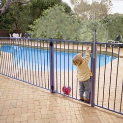 FenceMax.com - Picture of a child trying to open a Magna-Latch.