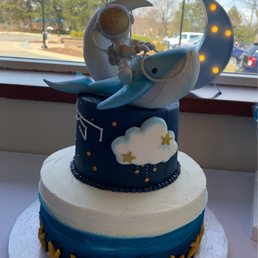 a blue and white birthday cake