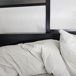 Just above pillows is a head board that you are guaranteed to bang your head on.