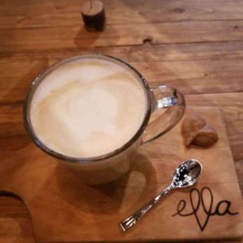 Ella Cafe - Delicious decaf cappuccino with whole milk and an expresso heart-shaped cookie on the side. - Coffee & Tea Near Me - Plantation, Florida