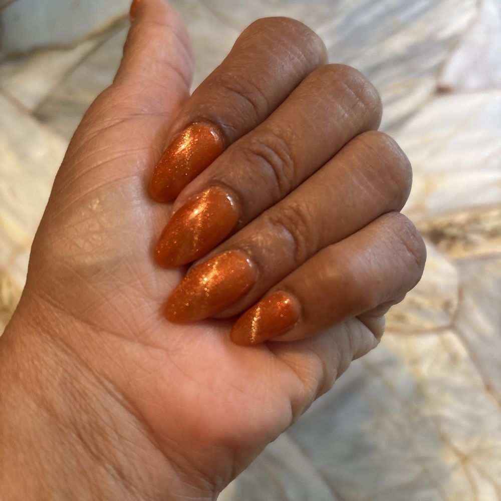 Envy Nails Spa - Getting ready for fall with my cat eye nails using a pumpkin color! - Nail Salons Near Me - St. Augustine, Florida