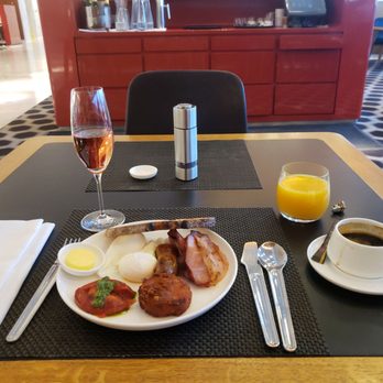 Qantas First Class Lounge - Signature breakfast w/a glass of sparking rose, OJ and long black - Airport Lounges Near Me - Mascot, NSW