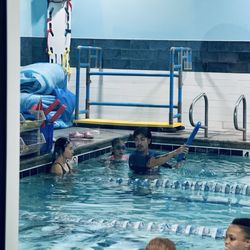 Water Wings Swim School - Swim instructor teaching my two kids.