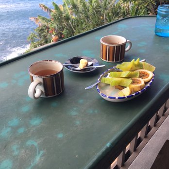 Blue Moon Massage Hale - Plate of fresh fruits, cups of hot tea, and glasses of water served post massage - Reflexology Near Me - Lahaina, Hawaii