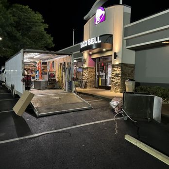 Taco Bell - Workers outside coming in and out of food service area from this vehicle into the back. - Fast Food Near Me - Daleville, Alabama