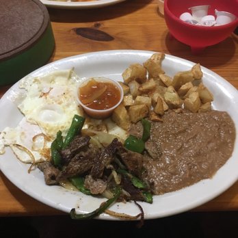 Las Rancheritas Cafe - Huevos rancheros with fajitas, and they just told me more fajitas are on the way because a little bit was served on my plate!!!!! Sweeet - Mexican Near Me - San Antonio, Texas