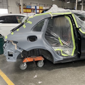 Crash Champions - Car in first step in paint. - Body Shops Near Me - Tustin, California Crash Champions - Car in first step in paint. - Body Shops Near Me - Tustin, California