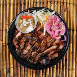 Parilya - Pork Inihaw: Tender & juicy flame-seared marinated pork laid on your choice of garlic fried rice or steamed white rice.