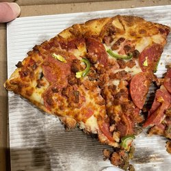 Sherwood Pizza - Pepperoni mushroom green pepper.  With some sausage we did not order. Day old photo.