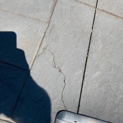 One of many cracks in the concrete patio. ACG never sealed it before the winter of 2021.
