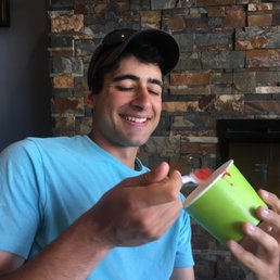a man holding a cup of coffee a man holding a cup of coffee