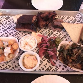 Bub City - Three meat entree (pork shoulder, wings, ribs) with coleslaw, Brussels Sprouts, Buffalo Tots, bread, pimento cheese, & pickled veggies - Bars Near Me - Rosemont, Illinois Bub City - Three meat entree (pork shoulder, wings, ribs) with coleslaw, Brussels Sprouts, Buffalo Tots, bread, pimento cheese, & pickled veggies - Bars Near Me - Rosemont, Illinois