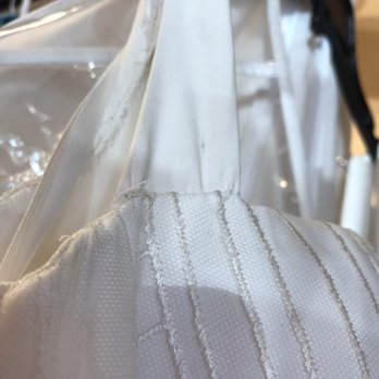 Dora Baker's Bridal Alterations - Wrinkles where the strap meets the bodice on the strap that was "altered". - Sewing & Alterations Near Me