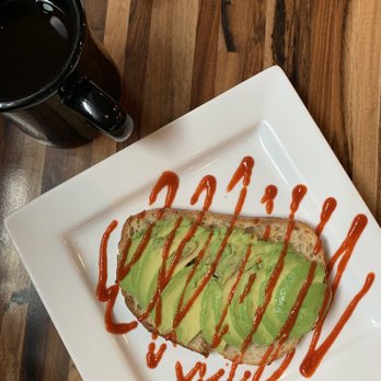 BLOC Coffee Company - Avocado toast on sourdough bread drizzled with Sriracha. - Coffee & Tea Near Me - Cincinnati, Ohio BLOC Coffee Company - Avocado toast on sourdough bread drizzled with Sriracha. - Coffee & Tea Near Me - Cincinnati, Ohio