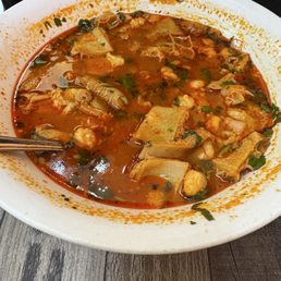 Menudo, good but pricy. Pretty decent portion. You actually get two meals out of one order.