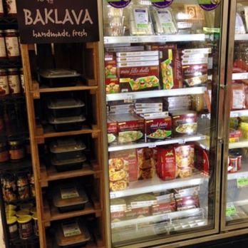 Greek to Go - a display of food in a grocery store - Caterers Near Me - Grand Rapids, Michigan Greek to Go - a display of food in a grocery store - Caterers Near Me - Grand Rapids, Michigan
