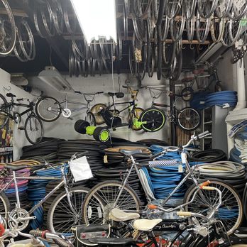 Bicycle Heaven - Colorful tires on the bottom and wheels hanging above - Museums Near Me - Pittsburgh, Pennsylvania Bicycle Heaven - Colorful tires on the bottom and wheels hanging above - Museums Near Me - Pittsburgh, Pennsylvania