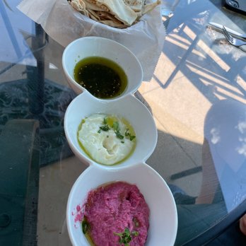 Rozanna - Complimentary app of humus and pita bread (mashed beats, mashed potatoes and olive oil). - Mediterranean Near Me - Manchester, Missouri Rozanna - Complimentary app of humus and pita bread (mashed beats, mashed potatoes and olive oil). - Mediterranean Near Me - Manchester, Missouri