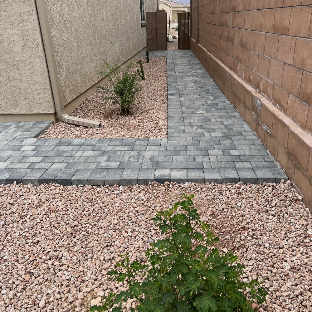 GreenLife Tree & Landscaping - a brick walkway between two houses - Landscaping Near Me - Tucson, Arizona