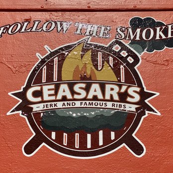 Ceasars Famous Ribs - a sign on a wall - Barbeque Near Me - Delray Beach, Florida