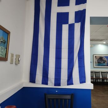 Bell Greek - Greek flag in front of my table. - Greek Near Me - Chester, Virginia