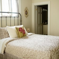 The Hiding Place - The Eisenstein Room is on the main level of the house and has a queen bed, loveseat, chair and a large standard tub shower bath.