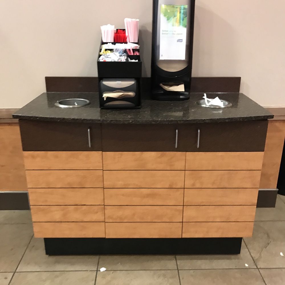 Dunkin' -  a coffee station with a mirror on top - Coffee & Tea Near Me - Philadelphia, Pennsylvania