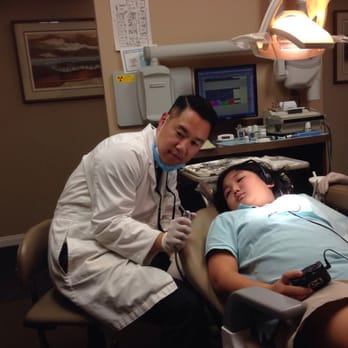 Ho Brandon DDS - Here is Dr. Brandon patiently explaining each instrument to my daughter who was initially a bit nervous. - General Dentistry Near Me - La Canada Flintridge, California