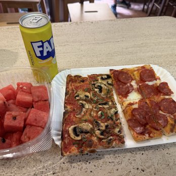 La Prezzemolina - Pepperoni and a Mushroom Pizza.    The watermelon was a nice touch on a hot day in Rome.! - Pizza Near Me - Rome, RM