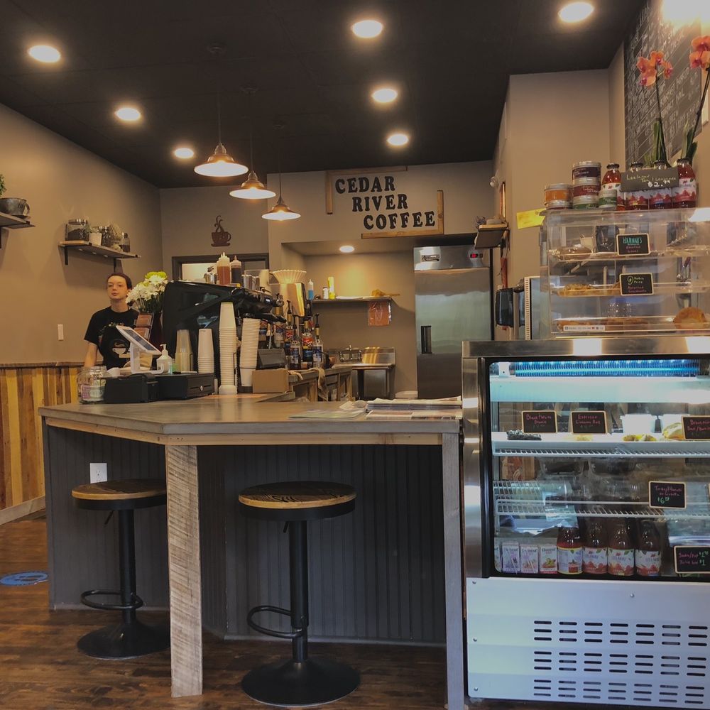 Coffee counter, more seating by windows Coffee counter, more seating by windows