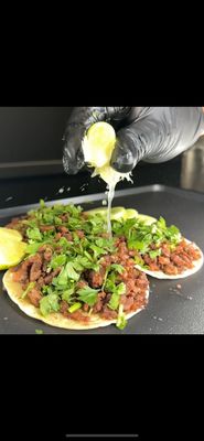 Sabor del Barrio: A Visual Taste of Tacos Trafi - Take a visual bite out of Tacos Trafi Catering, where every taco tells a story and every ingredient brings the heat. Featured here are our best-selling street tacos and signature toppings that keep Arizona events lit and taste buds dancing.
We specialize in on-site taco catering with customizable packages perfect for birthdays, weddings, office parties, and casual weekend hangouts. Our food isn’t just delicious—it’s a whole vibe. Every plate is handcrafted with fresh ingredients, bold flavors, and that signature Trafi touch. Sabor del Barrio: A Visual Taste of Tacos Trafi - Take a visual bite out of Tacos Trafi Catering, where every taco tells a story and every ingredient brings the heat. Featured here are our best-selling street tacos and signature toppings that keep Arizona events lit and taste buds dancing.
We specialize in on-site taco catering with customizable packages perfect for birthdays, weddings, office parties, and casual weekend hangouts. Our food isn’t just delicious—it’s a whole vibe. Every plate is handcrafted with fresh ingredients, bold flavors, and that signature Trafi touch.