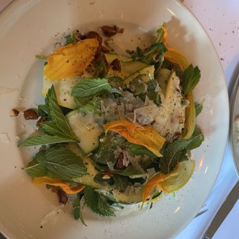 Chez Panisse - Rocket and shaved zucchini salad with squash blossoms, lemon, mint, almonds and pecorino, $19 - New American Near Me - Berkeley, California