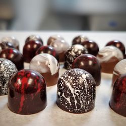Chocolate Wave - Indulge in the richness of freshly crafted Chocolate Bonbons, a delightful treat that's sure to brighten up your day.